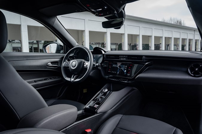 Alfa Romeo Junior Ibrida (2025) review: dashboard and infotainment system, black upholstery