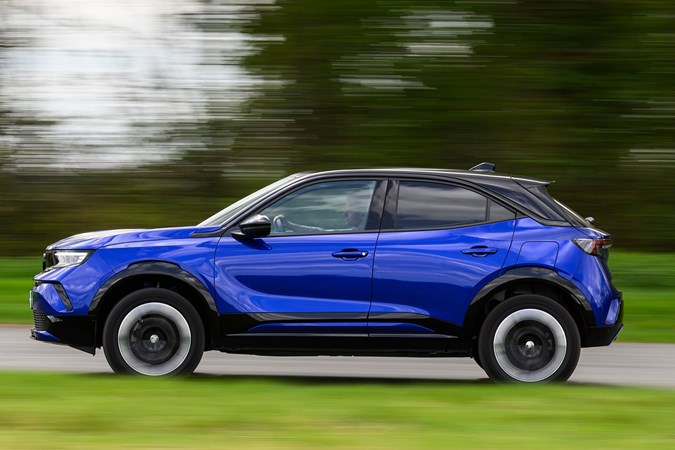 Vauxhall Mokka Electric review, driving, blue, side | Parkers