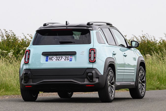 Renault 4 E-Tech review, moving, blue, rear three quarters | Parkers