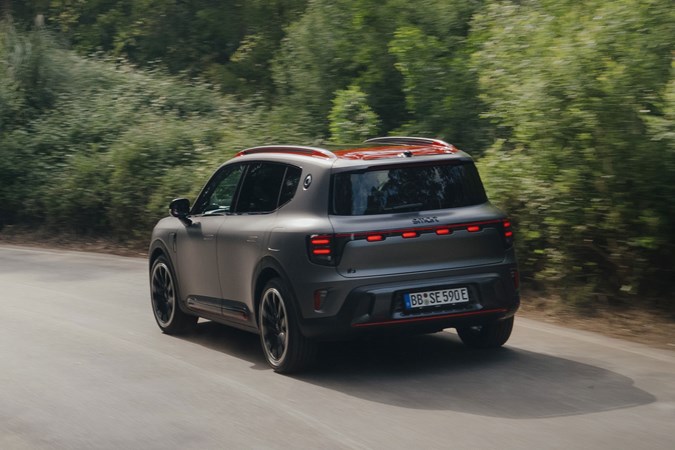 Smart #5 (2025) review: rear three quarter driving, matte grey paint, Brabus trim