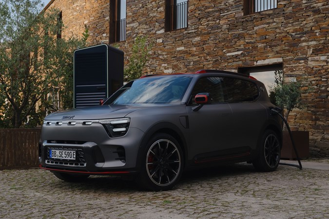 Smart #5 (2025) review: front three quarter static, matte grey paint, plugged in charging, Brabus trim