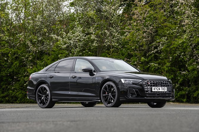 Image of a static, black Audi S8, looking at its front right corner