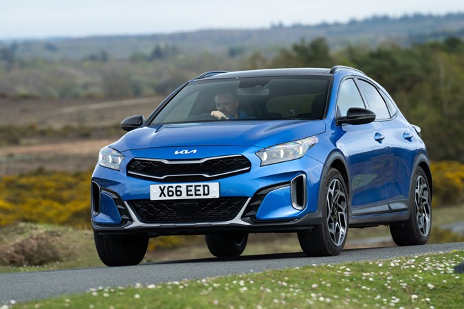 Kia XCeed review - facelift, blue, front, driving round corner
