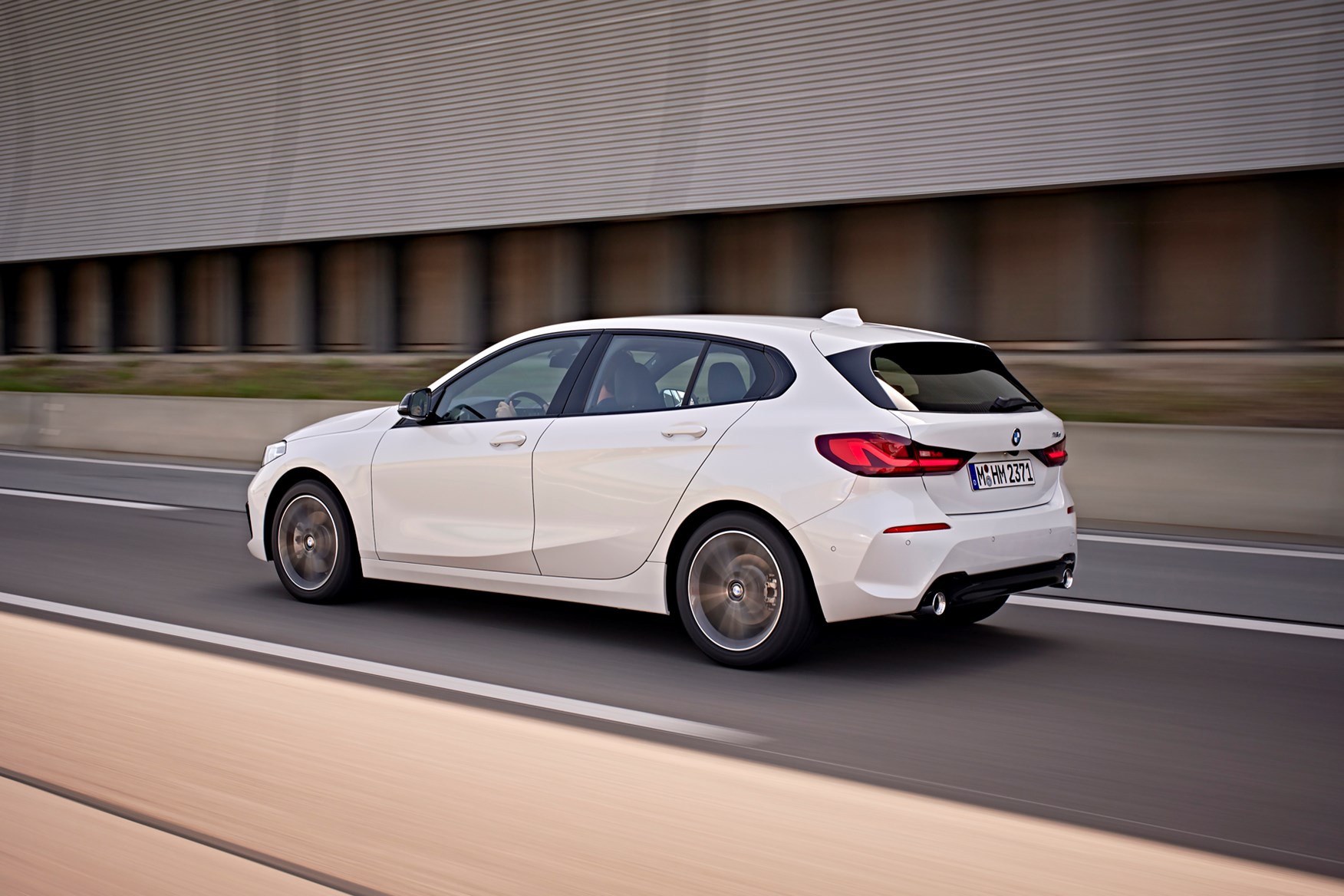 BMW 1 Series Hatchback in motion, highlighting compact proportions and sporty stance