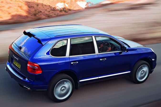 Porsche Cayenne, rear three quarters, blue, driving | Parkers
