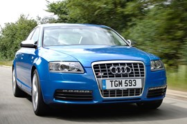 The Audi S6 V10, blue, front three-quarters, driving