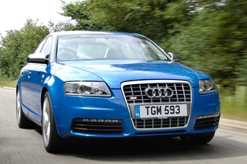 The Audi S6 V10, blue, front three-quarters, driving