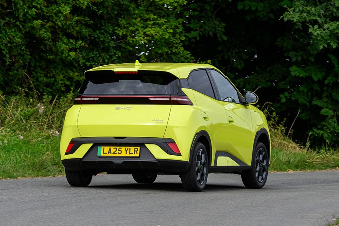 BYD Dolphin Surf (2025) review: rear three quarter cornering, yellow paint