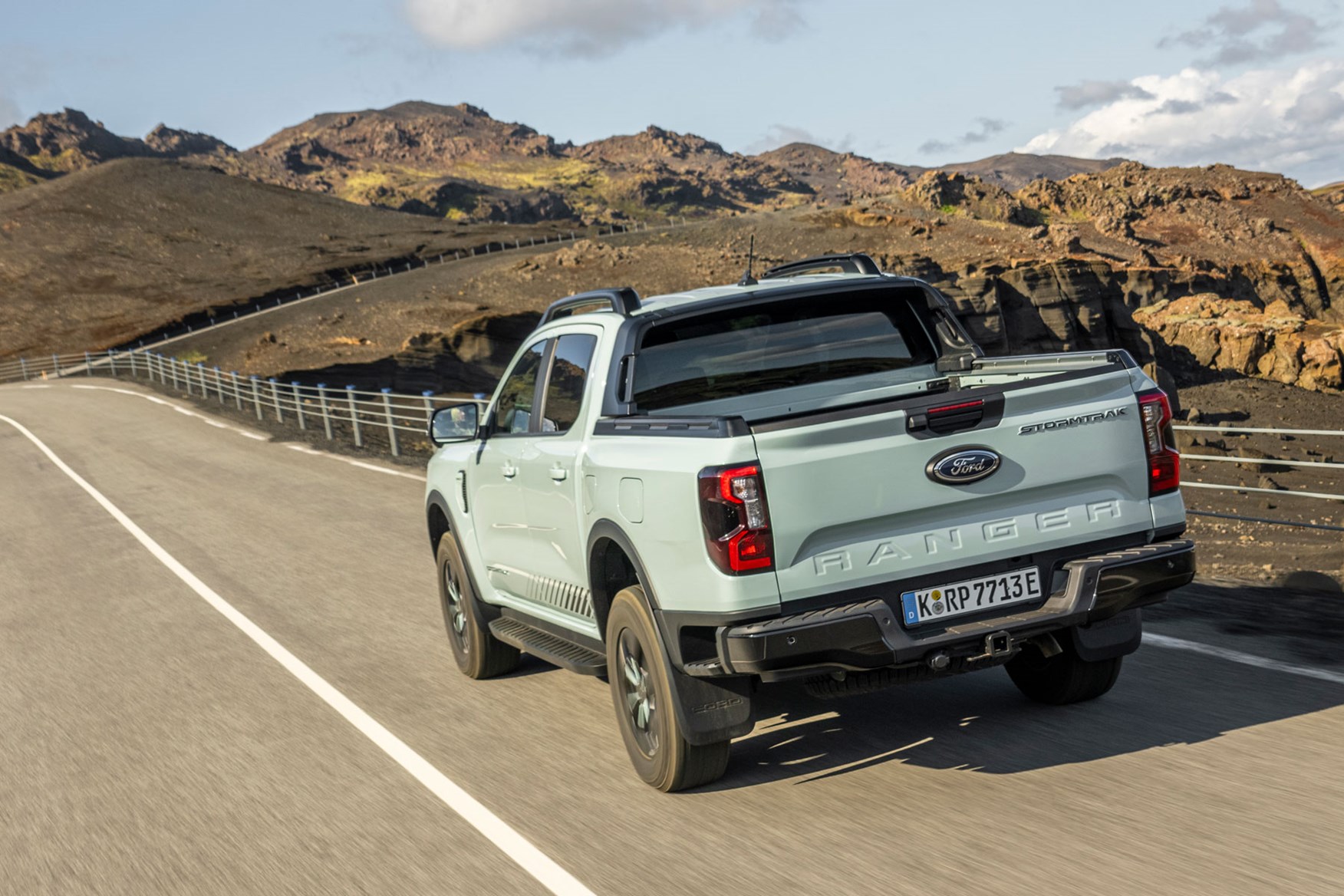 Ford Ranger Plug-in Hybrid review on Parkers - Stormtrak, rear, grey, driving