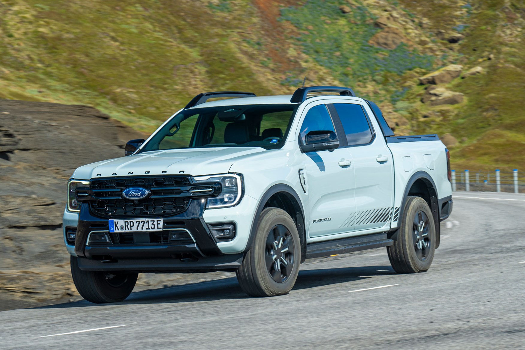Ford Ranger Plug-in Hybrid review on Parkers - Stormtrak, front, grey, driving