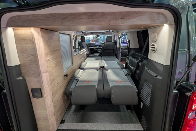 Image of the Citroen Holidays interior with the bed folded out, seen through the open tailgate