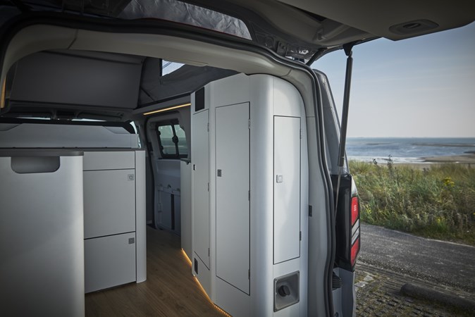 Image of the Ford Transit Custom Nugget interior, looking towards the front through the open tailgate