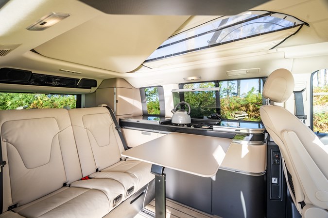 Image of the Mercedes Marco Polo interior, looking at the dining area from the open rear side door