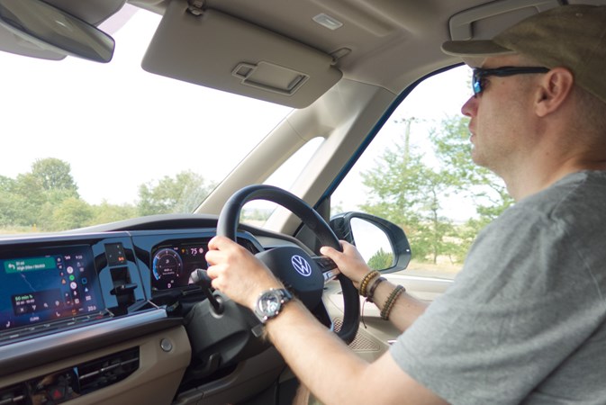 Image of a driver at the wheel of a Volkswagen California campervan