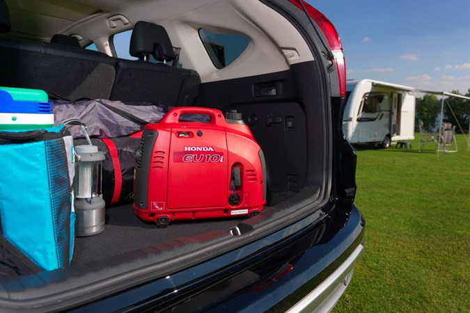 Image of a Honda power station in the boot a Volvo XC90