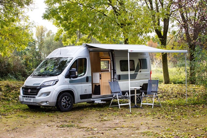 Image of a Vantage Motorhomes Sol Fiat Ducato with awning and furniture set up