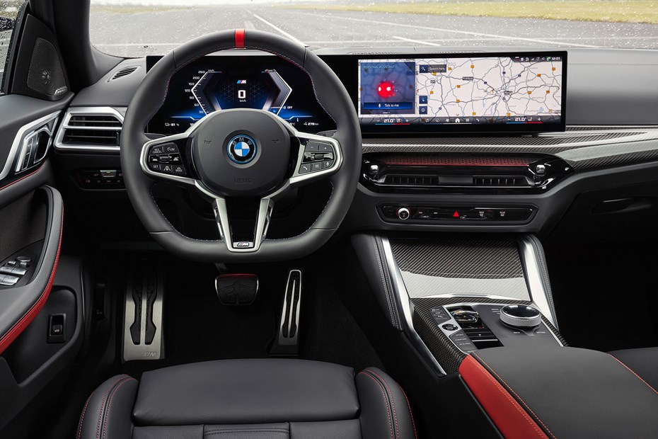 BMW i4 (2024) review: dashboard and infotainment system, black and red leather upholstery