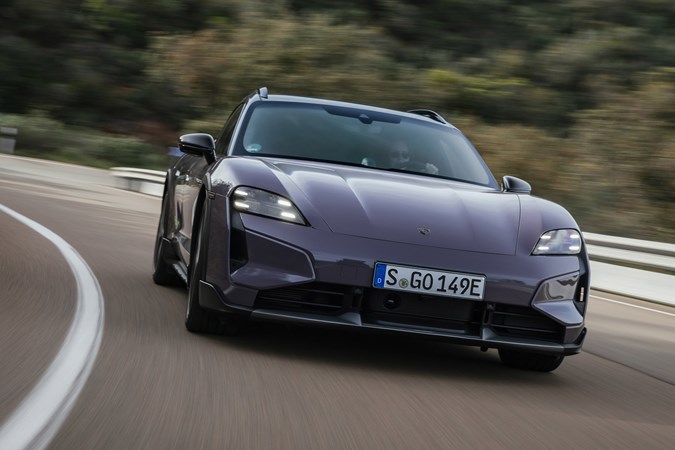 Porsche Taycan Cross Turismo review: front three quarter cornering, purple paint