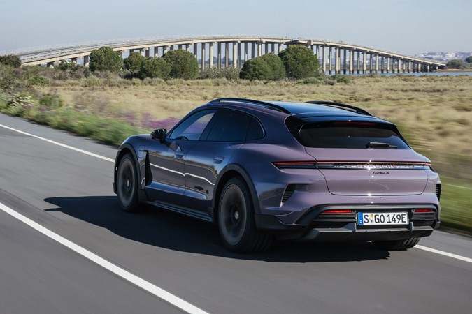 Porsche Taycan Cross Turismo review: rear three quarter driving, purple paint