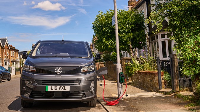 A van charging from a lamp post outside some one's home