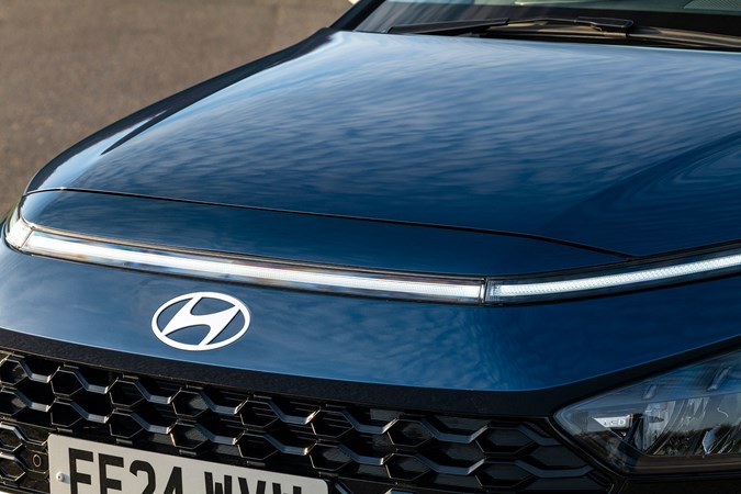 Hyundai Bayon (2025) review: front badge and light bar, blue paint