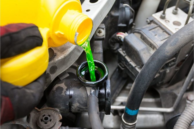 Car engine with fluid being added