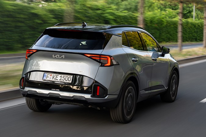 Kia Sportage review, silver, moving, rear (2025)