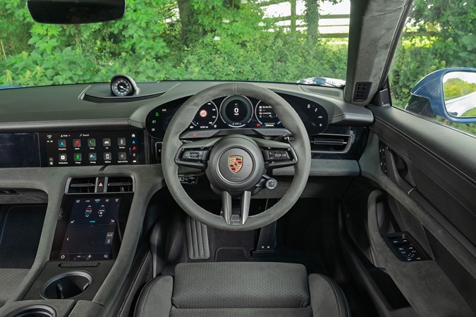 2022 Porsche Taycan Sport Turismo dash Porsche Taycan Sport Turismo (2025) review: steering wheel and digital gauge cluster, grey Alcantara trim