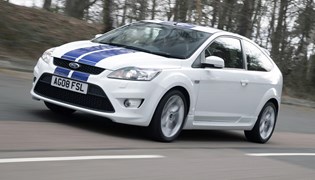 Image of a white 2008 Ford Focus ST, viewed from the front left corner while driving
