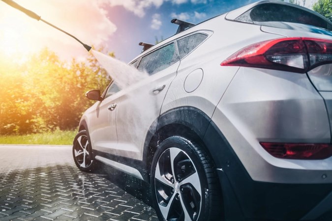 Image of a pressure washer cleaning a a Hyundai Tucson