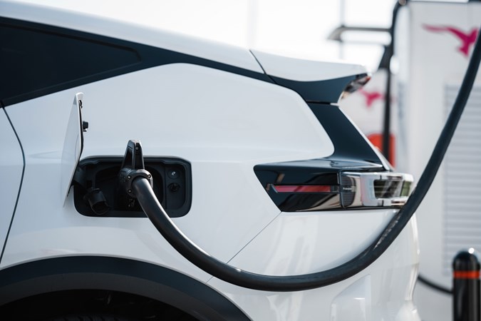 Used electric car sale rising - rear of white EV charging