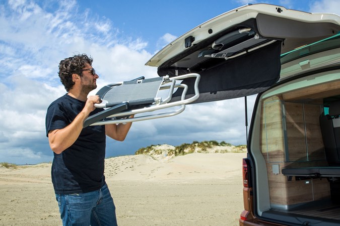 VW California review - 2019 T6.1 model, man removing chairs from tailgate