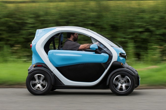 Blue and white 2018 Renault Twizy coupe side elevation driving